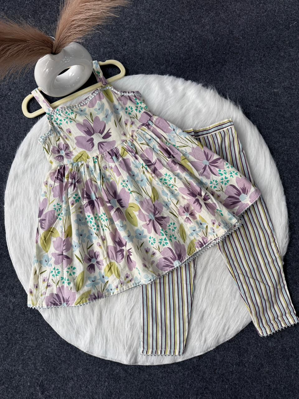 Sleeve less peplum with striped pant